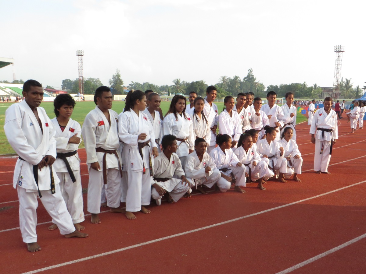 The karate team prepares to start teaching kids